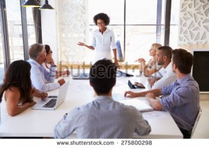 stock-photo-businesswoman-presenting-to-colleagues-at-a-meeting-275800298 (1)