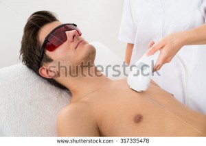 stock-photo-close-up-of-female-worker-giving-man-laser-epilation-on-chest-in-salon-317335478