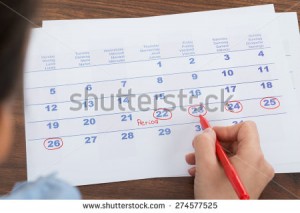 stock-photo-close-up-of-person-marking-menses-date-on-calendar-274577525