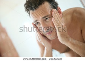 stock-photo-handsome-man-rinsing-face-after-shaving-239293078