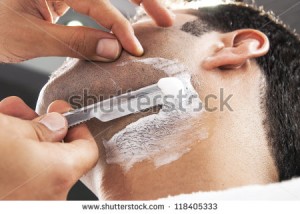 stock-photo-man-having-a-shave-at-the-barber-shop-118405333
