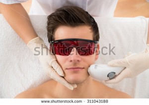 stock-photo-close-up-of-beautician-giving-laser-epilation-treatment-to-young-man-face-311043188